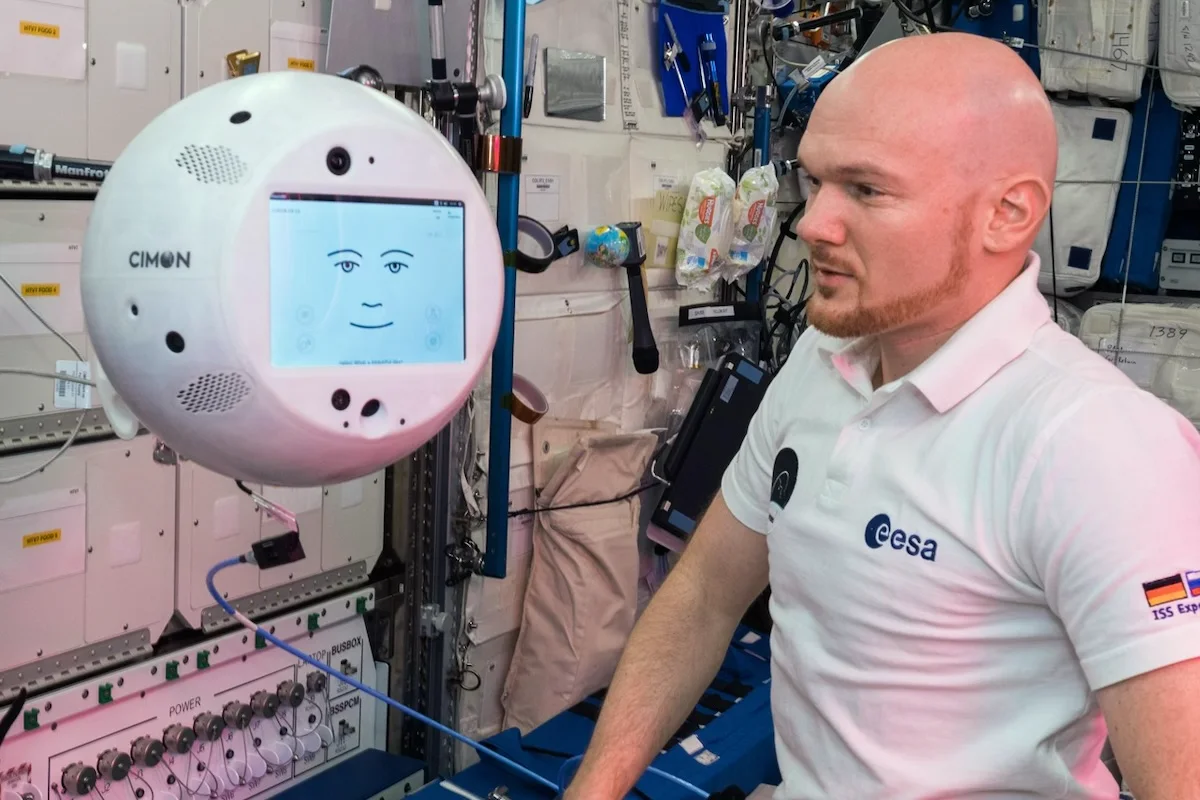 ESA astronaut working with CIMON aboard the International Space Station