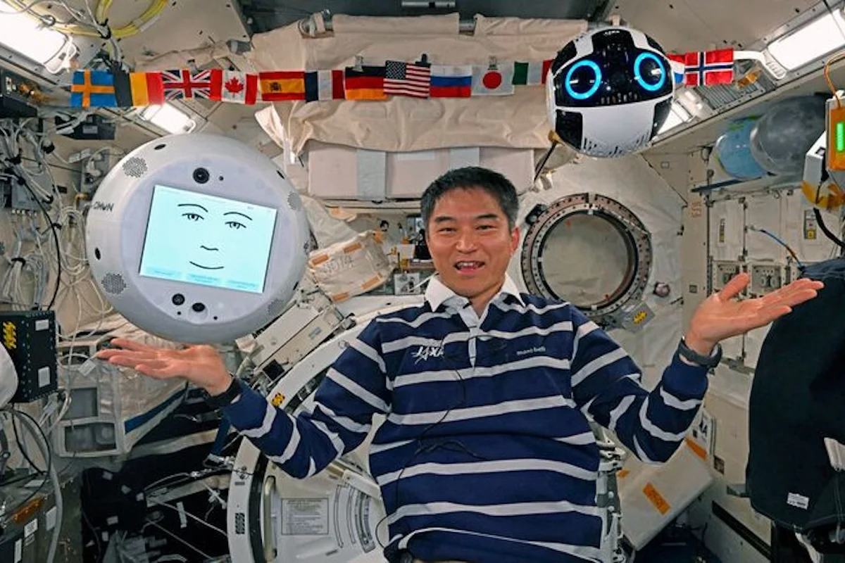 JAXA astronaut on the ISS with two CIMON robotic AI assistants